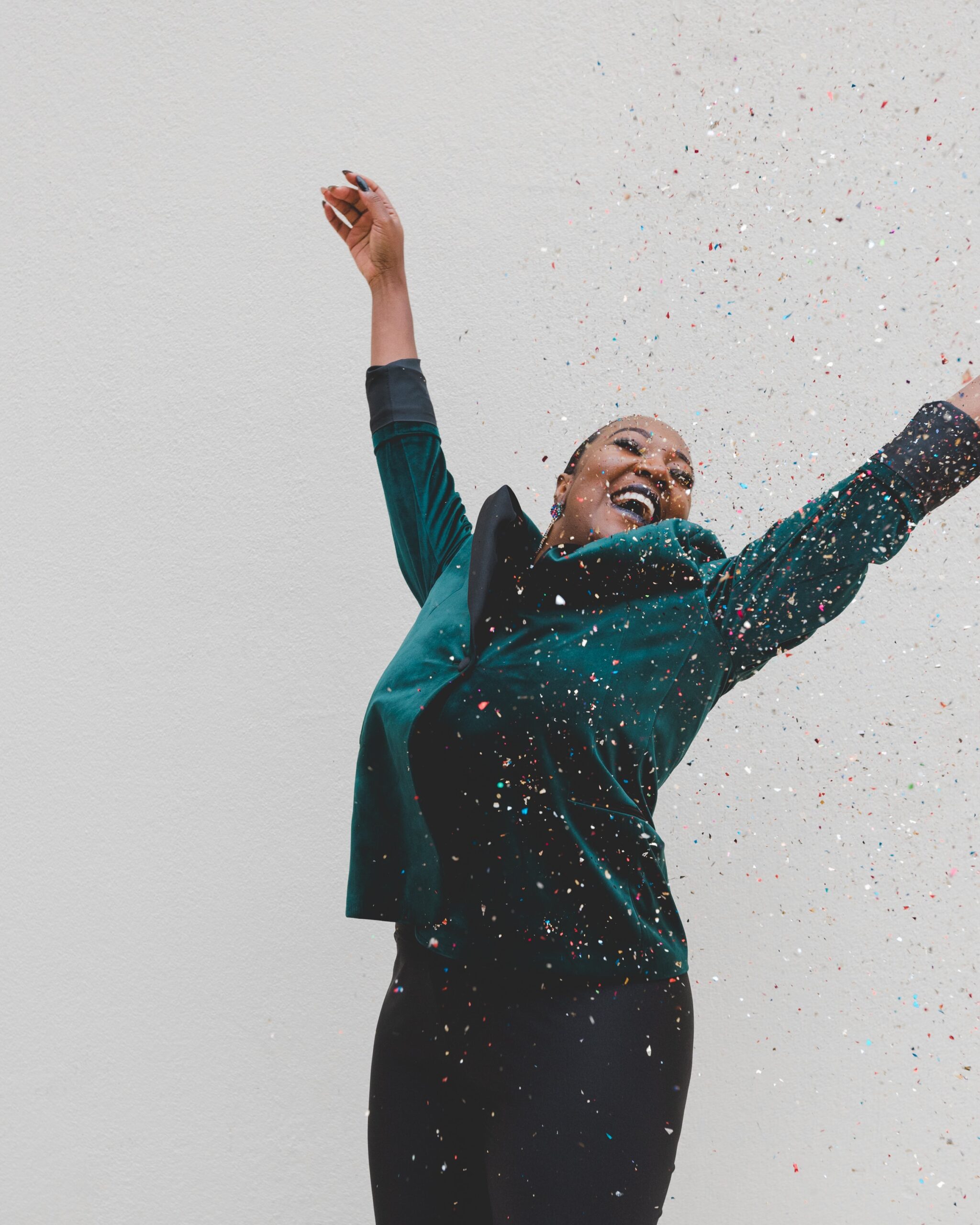 joyous-black-woman-green-suit